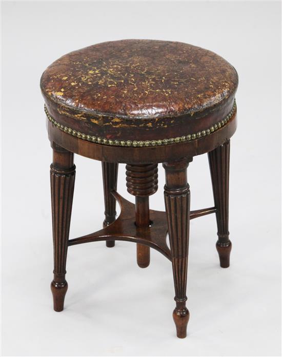 A Regency rosewood circular revolving piano stool,